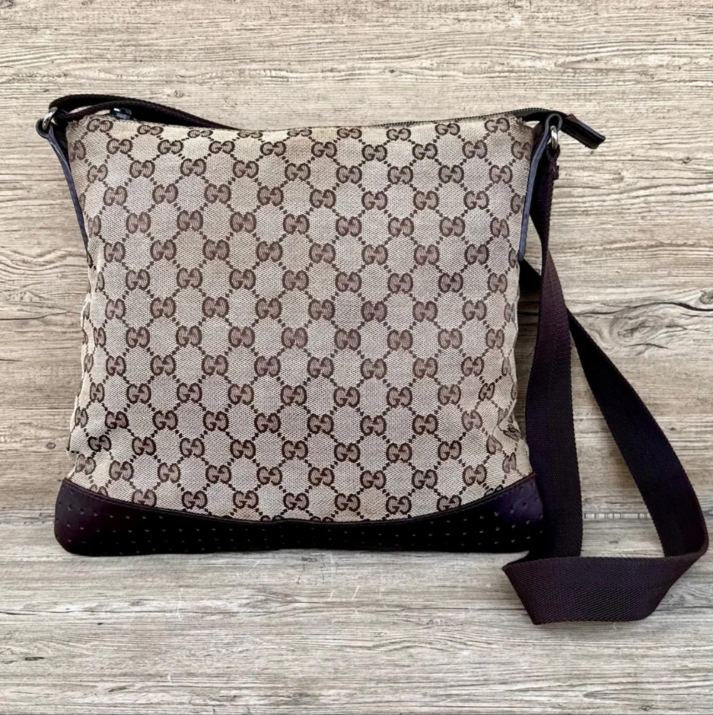 Gucci GG Monogram perforated leather messenger bag